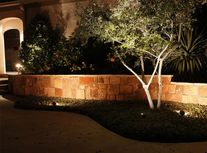landscaping lights along stone fence